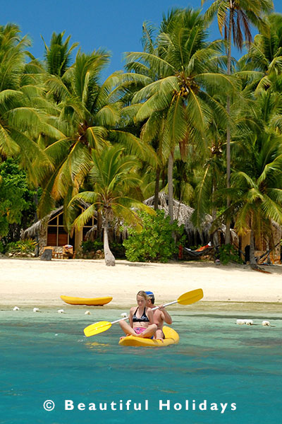 kayaking off beach in fiji islands 
