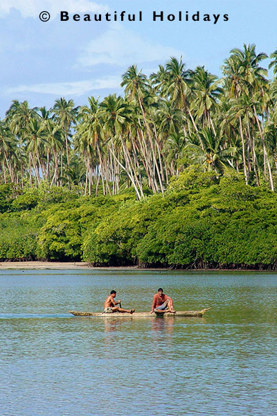 samoan fishermen in traditional dug-out canoe