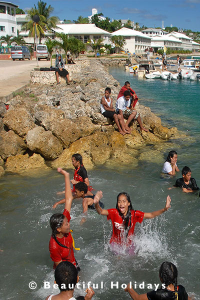 kids play at neifau harbour in vavau